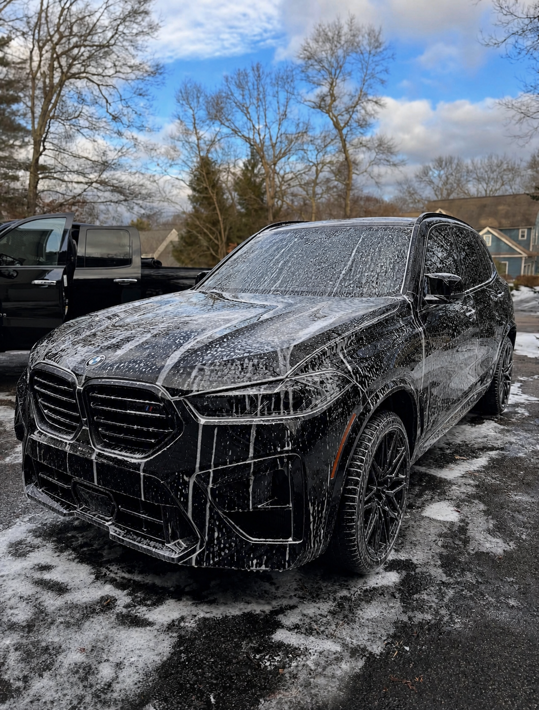 Foam-covered BMW being detailed